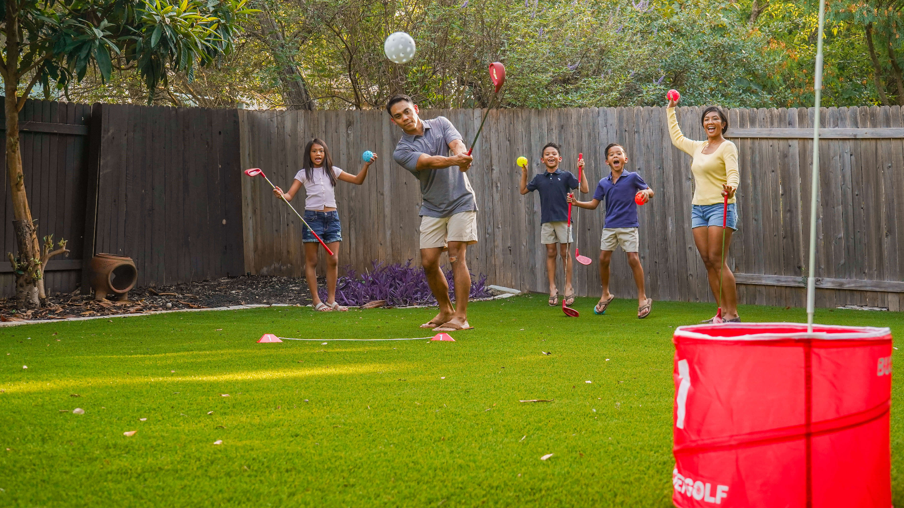 BucketGolf family playing in a backyard